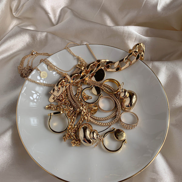 An assortment of yellow gold estate jewelry pieces 